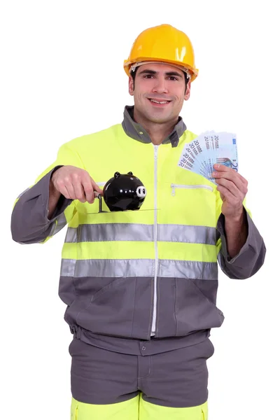 Homem trabalhador com suas poupanças suadas — Fotografia de Stock