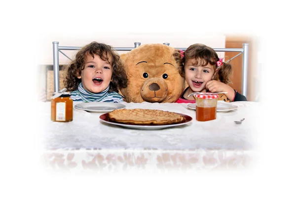 Children at a table — Stock Photo, Image