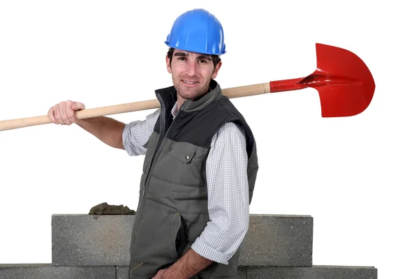 A mason holding a shovel. — Stock Photo, Image