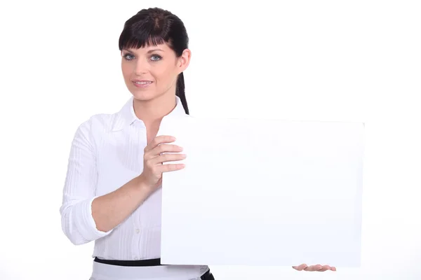 stock image Woman holding a board left blank for your message