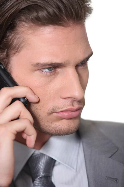 Empresario haciendo una llamada telefónica — Foto de Stock
