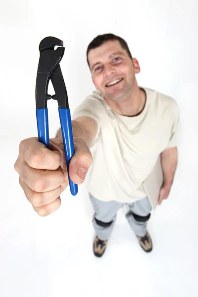 Trabalhador segurando clipper — Fotografia de Stock