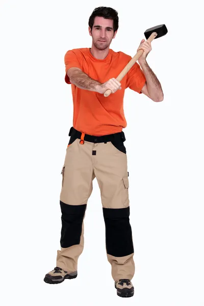 A man with a sledgehammer. — Stock Photo, Image