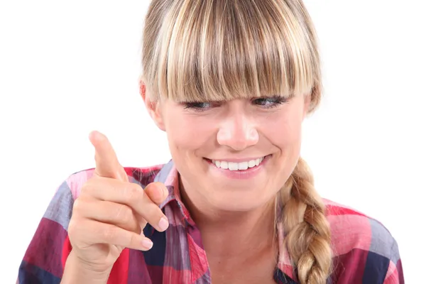 Young woman wagging her finger in a lighthearted manner — Stock Photo, Image