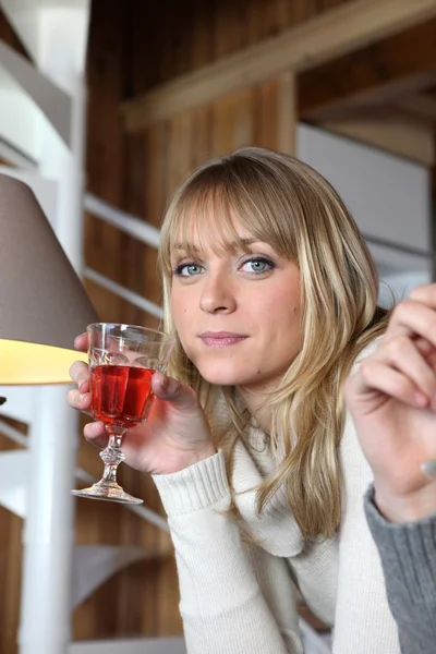 Woman drinking a glass of wine — Stock Photo, Image
