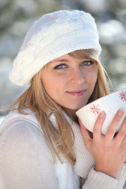 Woman drinking from bowl clipart