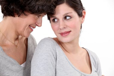 Mother and daughter looking at each other clipart