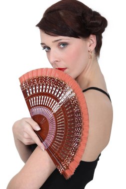 Spanish dancer holding a fan clipart