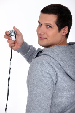 Sporty man with a stopwatch clipart