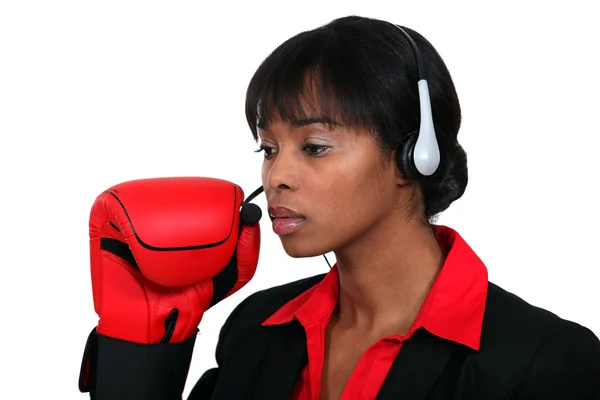Woman with audio helmet and boxing gloves — Stock Photo, Image