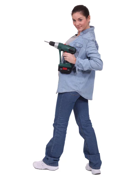 Sexy craftswoman holding a drill — Stock Photo, Image