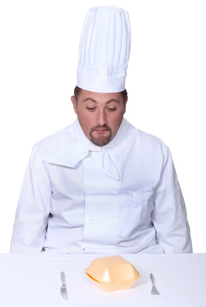 Шеф-кухар дивиться на бургерну коробку — стокове фото