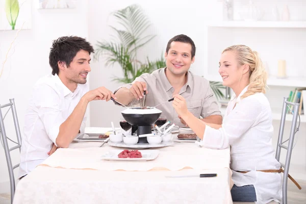 Fondue with friends — Stock Photo, Image