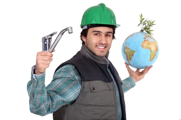Loodgieter met een kraan en een globe — Stockfoto