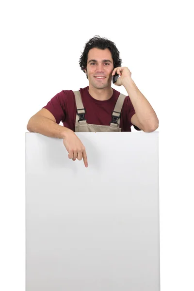Artisan pointing white panel — Stock Photo, Image