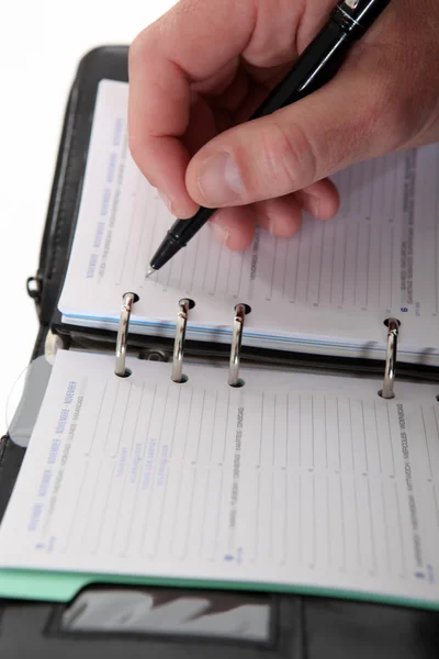 Zakelijke schrijven in een dagboek — Stockfoto