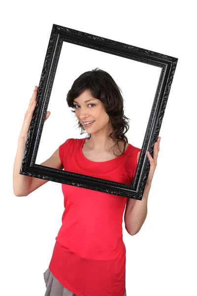Woman holding a picture frame — Stock Photo, Image