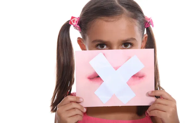 Little girl holding picture of mouth — Stock Photo, Image