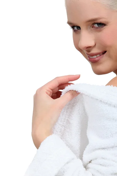 Woman putting her bathrobe on after a bath — Stock Photo, Image