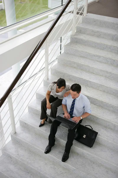 Business on a stairwell — Stock Photo, Image