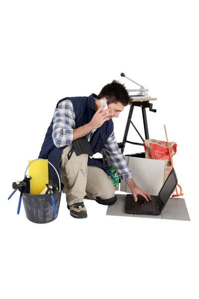 Man ordering extra tiles to complete job — Stock Photo, Image