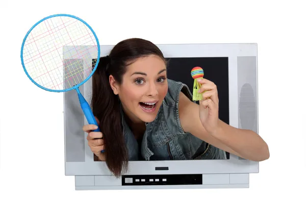 Girl in TV screen with badminton racket and shuttlecock — Stock Photo, Image