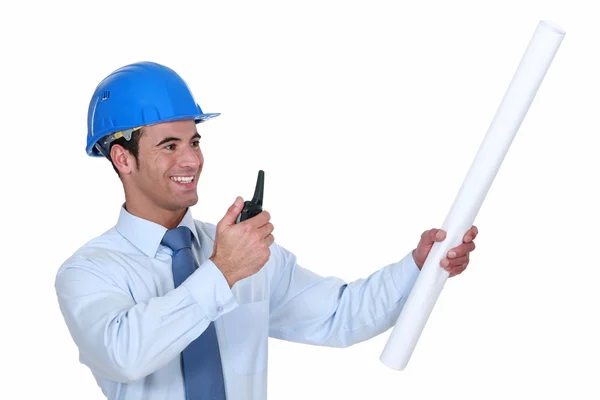 Architect with radio receiver and plans — Stock Photo, Image