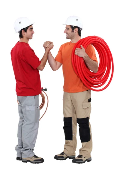 Duo van loodgieters geïsoleerd op wit — Stockfoto
