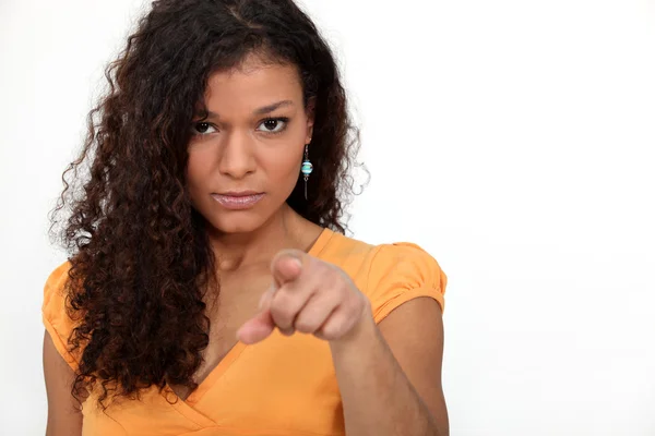 Women with curly hair pointing — Stock Photo, Image