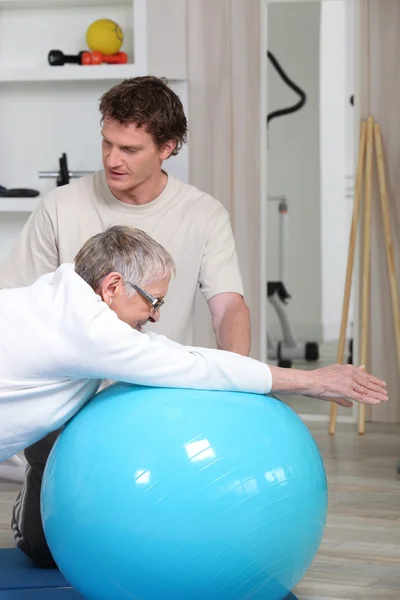 Old woman in rehabilitation class - Stock Image - Everypixel