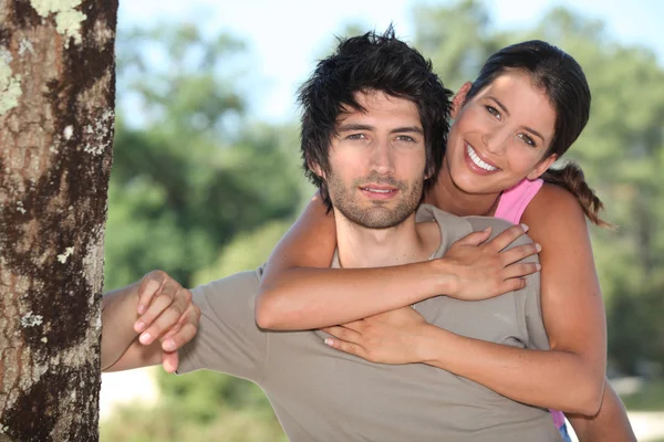 Tanned couple outdoors — Stock Photo, Image