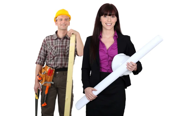 Tradesman admiring a female engineer from afar — Stock Photo, Image
