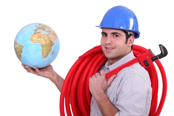 Tradesman in possesso di un globo — Foto Stock
