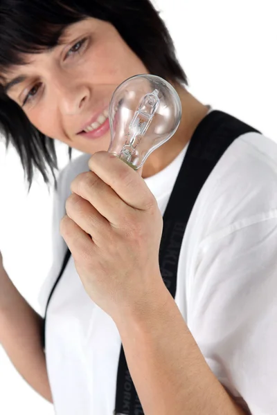 Electrician holding replacement bulb — Stock Photo, Image