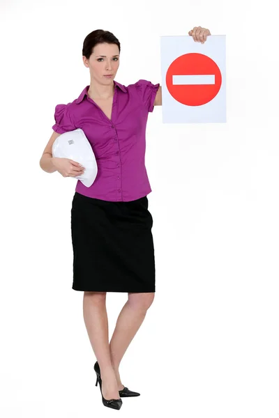 Woman holding road sign — Stock Photo, Image