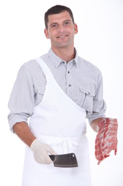 A butcher taking a chopper and pork ribs clipart