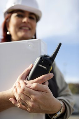 Female architect with radio receiver clipart