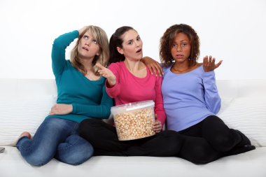 Women disappointed by the end of a movie clipart
