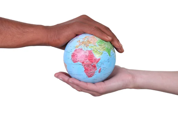 Hands cupped around a globe — Stock Photo, Image