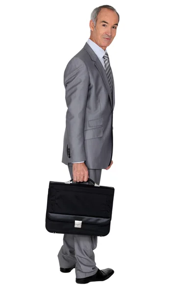 Full length portrait of an older businessman with a briefcase — Stock Photo, Image