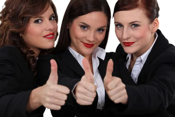 Três mulheres de negócios dando o polegar . — Fotografia de Stock