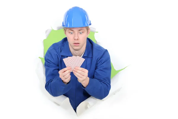 Builder amazed by the card he's been dealt — Stock Photo, Image