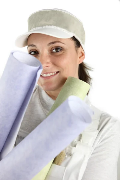 Woman holding selection of wallpaper — Stock Photo, Image