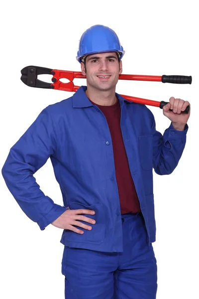 Craftsman with tongs over his shoulder — Stock Photo, Image