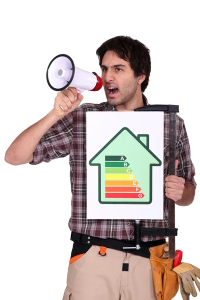Man with speaker and energy rating sign — Stock Photo, Image