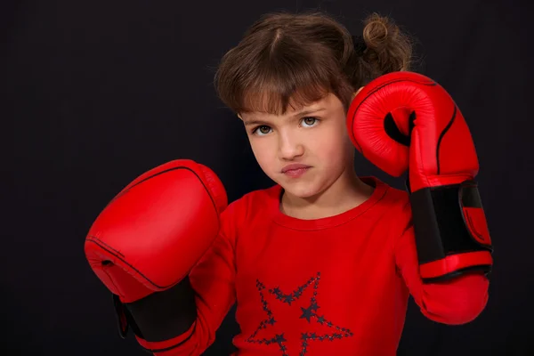 Little girl wearing boxing gloves — Stock Photo, Image