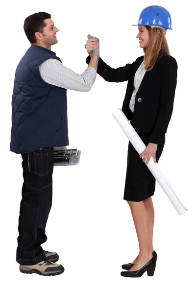 Architect shaking hands with a tiler — Stock Photo, Image