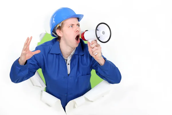 Blue collar shouting in loudspeaker — Stock Photo, Image