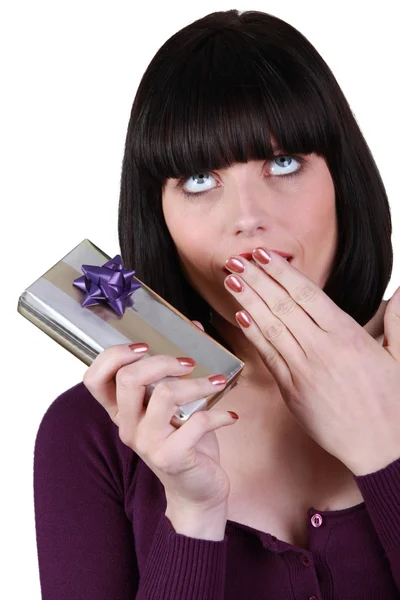 Brunette surprised by gift — Stock Photo, Image