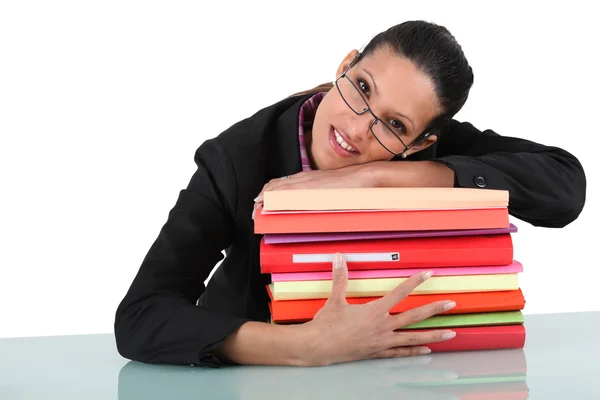 Businesswoman holding a pile of folders — Stock Photo, Image